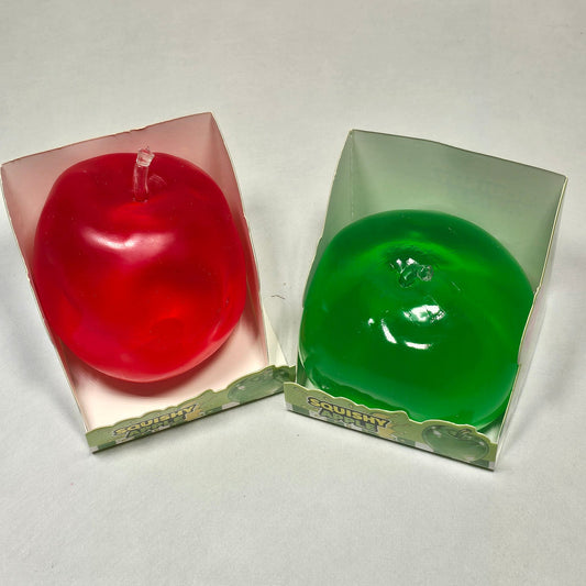 Two small square translucent sensory toy, one green and one red, shown on a plain light background.