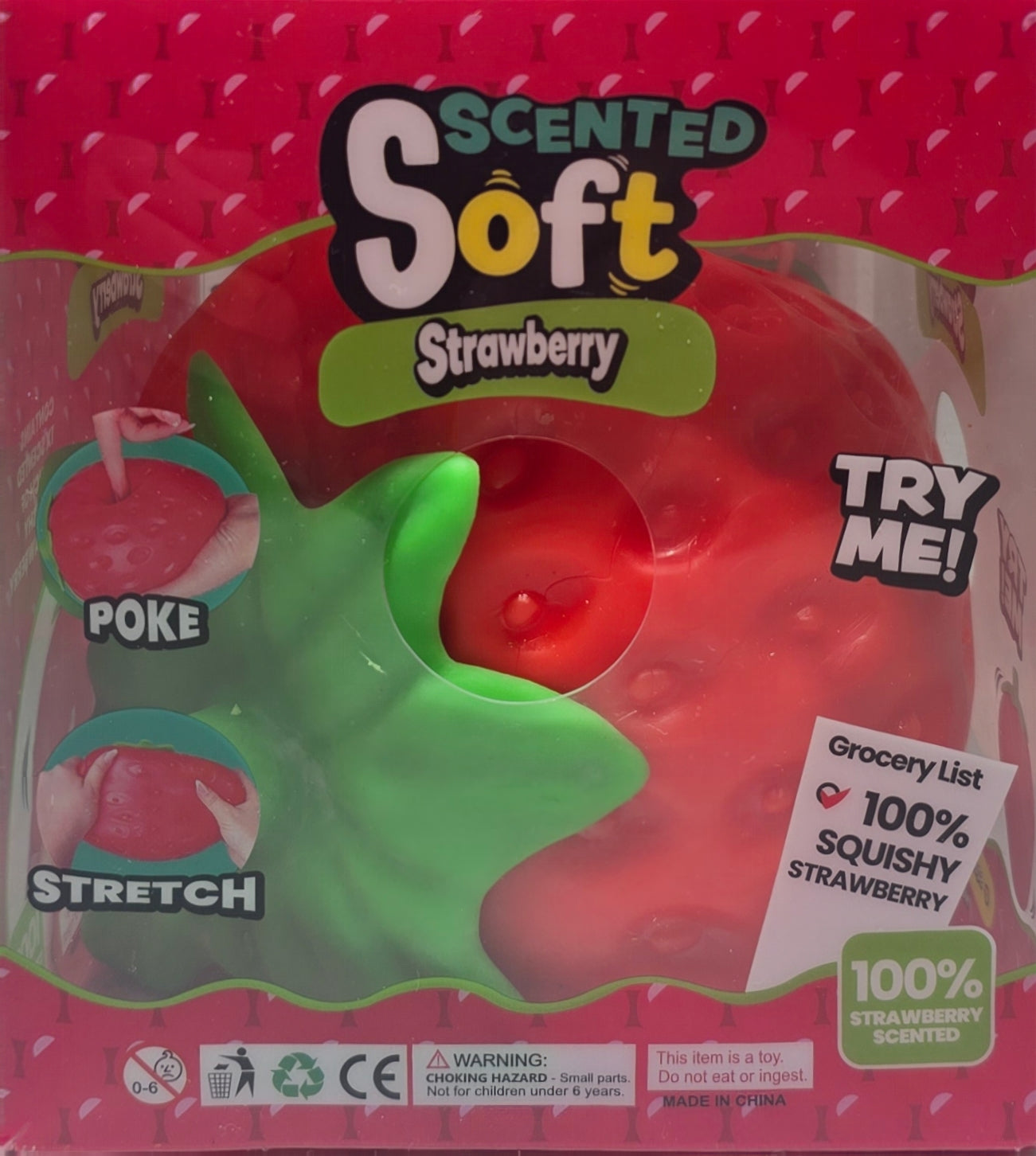 Packaged 'Scented Soft Strawberry' squishy toy, showing a red strawberry-shaped squishy with a green leafy top, inside a pink retail box with instructional graphics and a 'TRY ME!' callout.