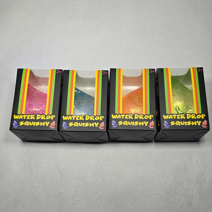 Four stacked rectangular product boxes with clear front windows and yellow side labels, photographed against a plain light gray background.